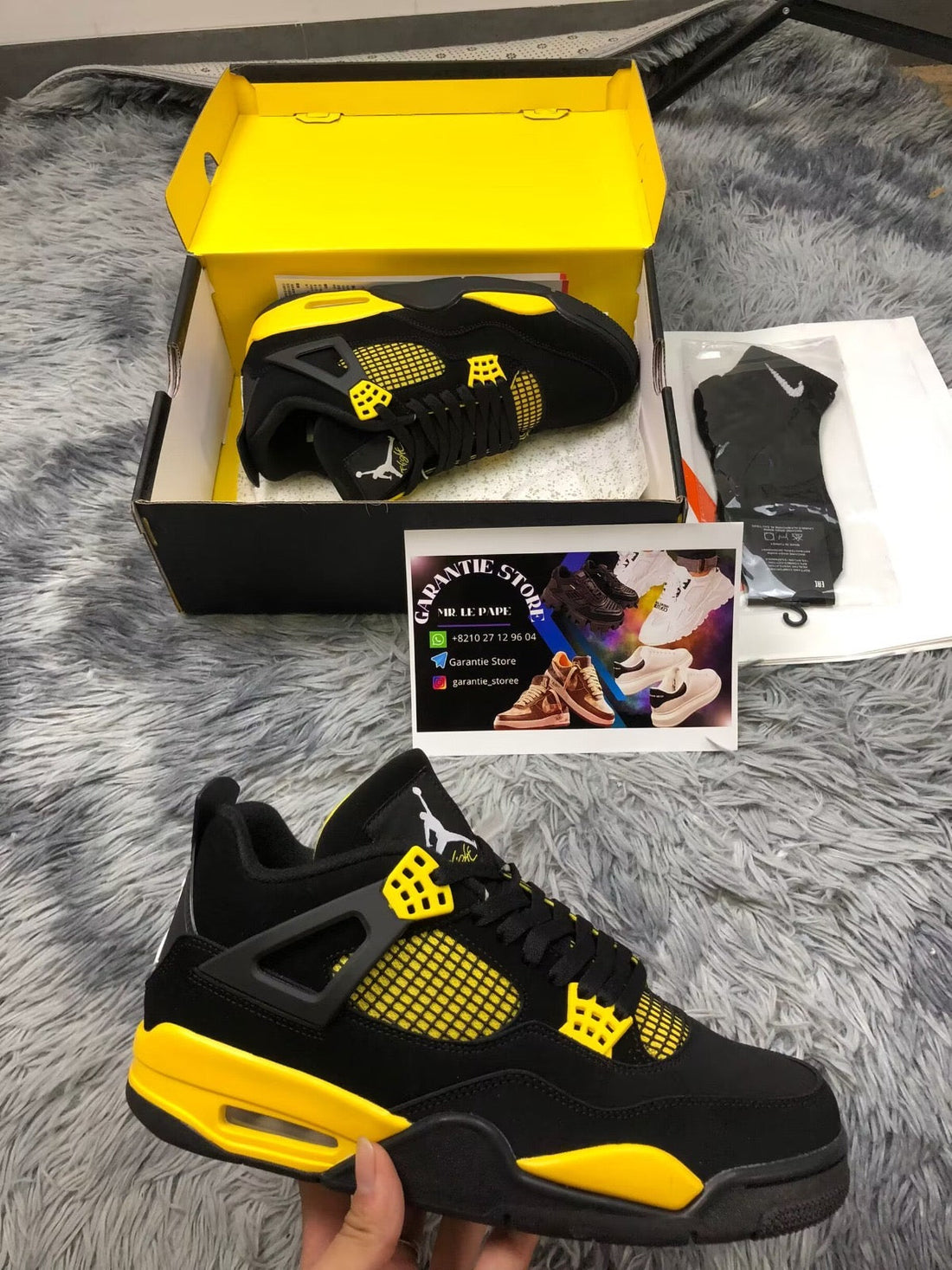 Jordan
Air Jordan 4 Retro "Thunder 2023" sneakers